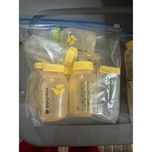 Lot of 8 Medela Bottles with 2 Nipples and Lids (Lot 2) 5 Oz.